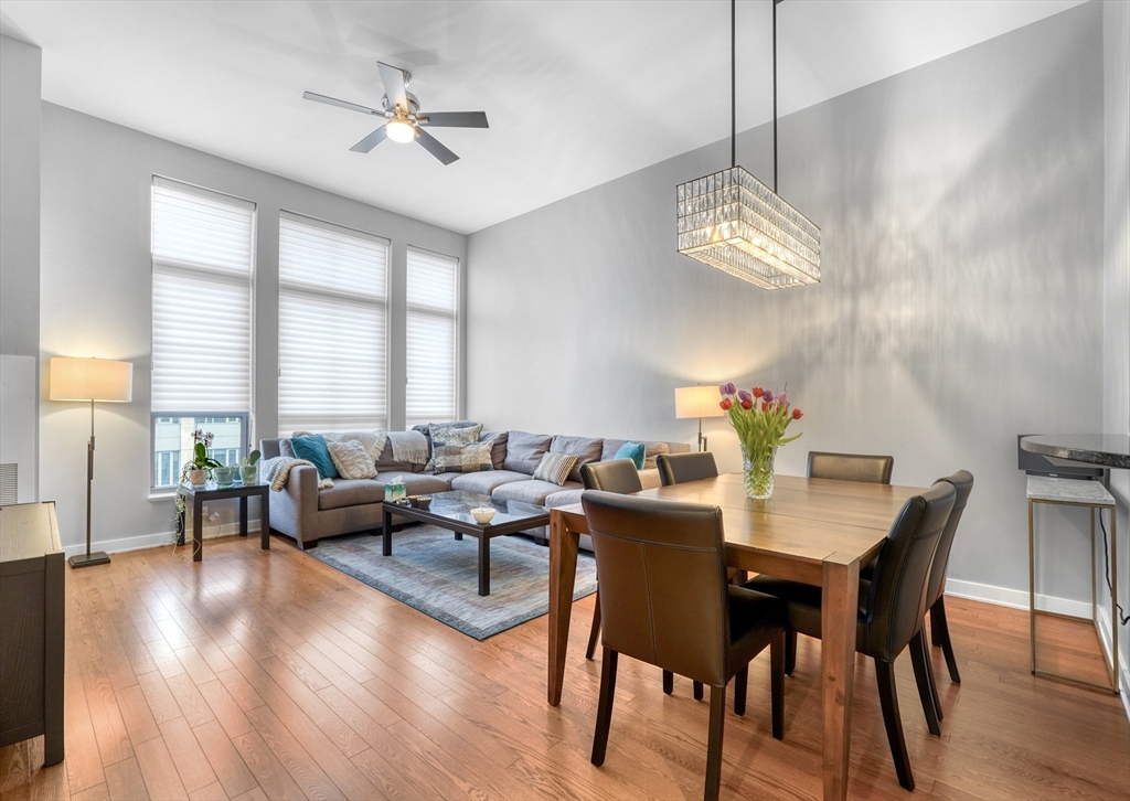 2 Rollins Street, Unit D603 Boston, MA 02118 - Photo 8 of 20 a view of a dining room with furniture a chandelier and wooden floor