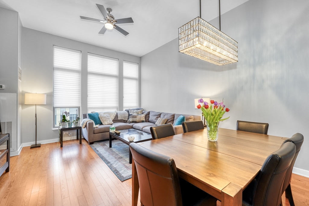 2 Rollins Street, Unit D603 Boston, MA 02118 - Photo 10 of 20 a view of a dining room with furniture a chandelier and wooden floor