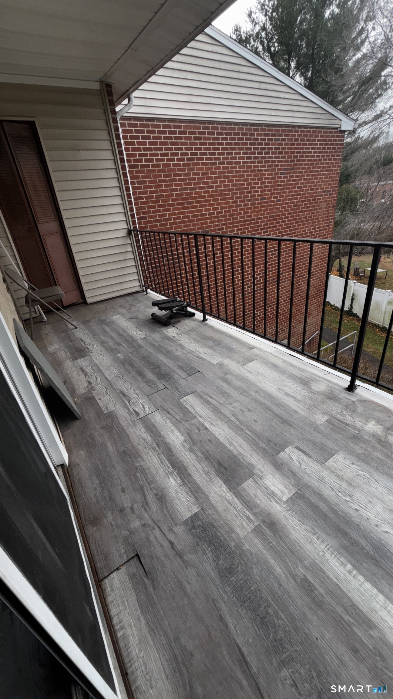 50 Greenhouse Road, Unit 33C Bridgeport, CT 06606 - Photo 22 of 33 a view of backyard with wooden floor