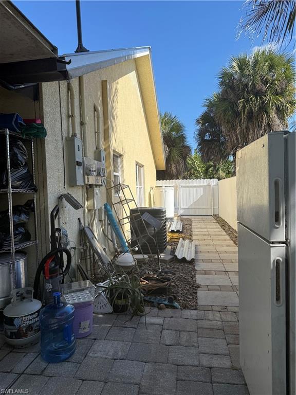 2531 47th Terrace Southwest Naples, FL 34116 - Photo 11 of 17 a view of a house with backyard and furniture