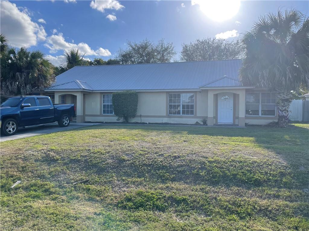 2531 47th Terrace Southwest Naples, FL 34116 - Photo 2 of 17 a view of a house with a yard
