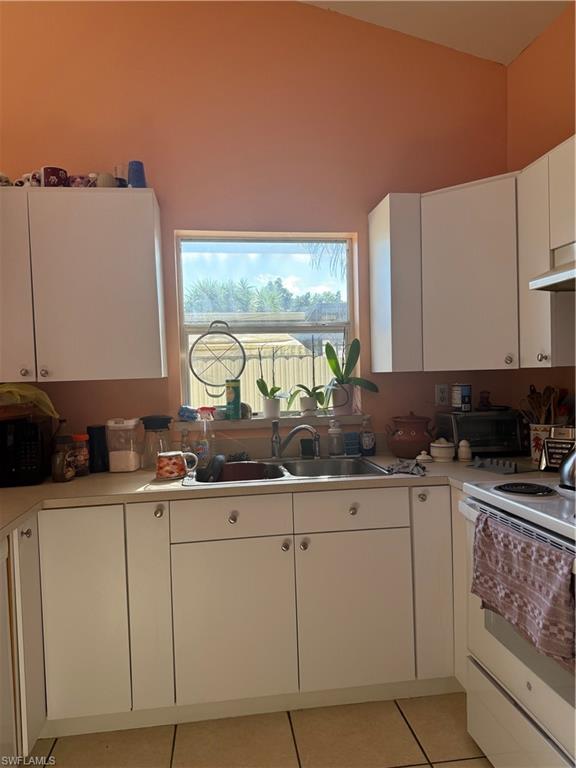 2531 47th Terrace Southwest Naples, FL 34116 - Photo 7 of 17 a kitchen with a sink and cabinets
