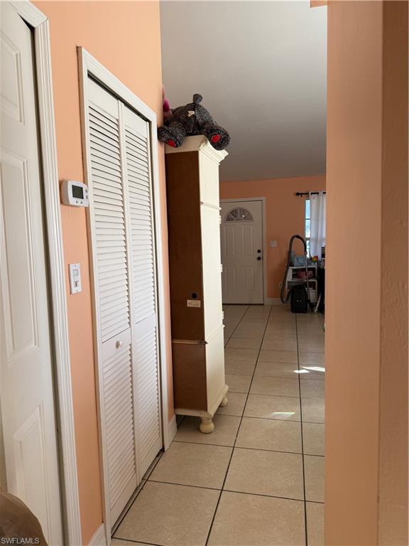 2531 47th Terrace Southwest Naples, FL 34116 - Photo 8 of 17 a view of hallway with stairs and a window