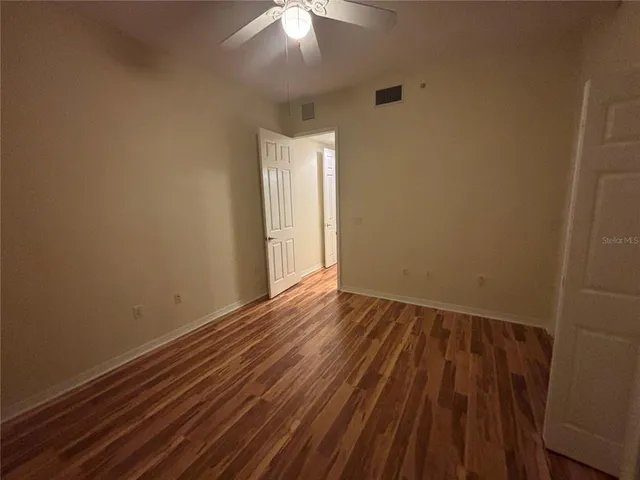 a white toilet sitting next to a sink