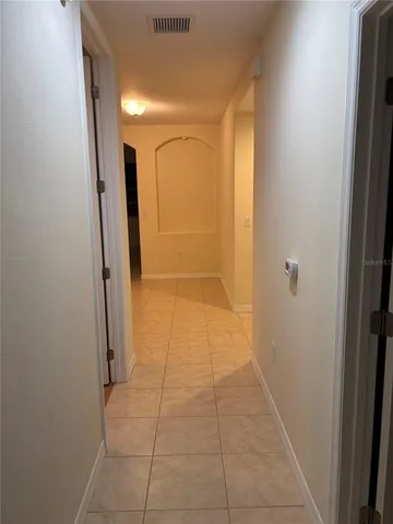 a view of empty room with a fireplace