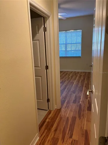 a view of front door with wooden floor