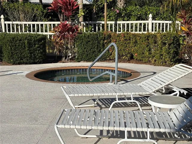 a view of balcony with furniture