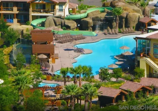 an aerial view of multiple houses with yard