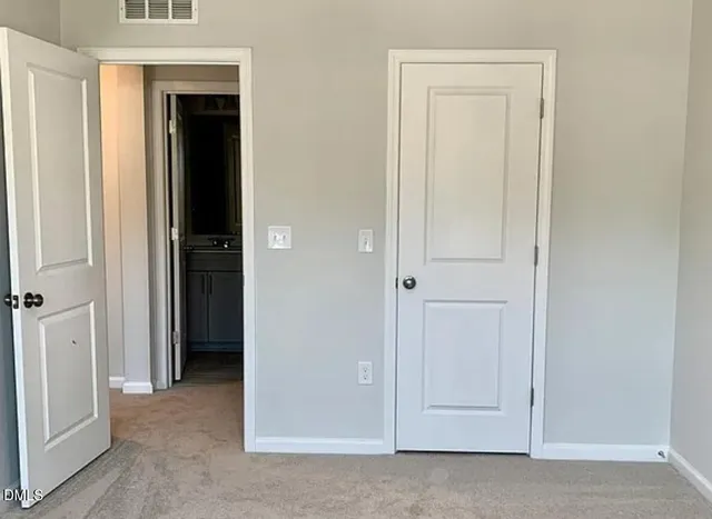 a bathroom with a sink toilet and a mirror