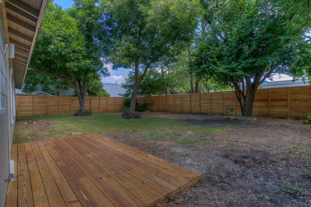 2011 Fort View Road Austin, TX 78704 - Photo 24 of 28 Mature trees shade a spacious backyard fully enclosed by a wood privacy fence.
