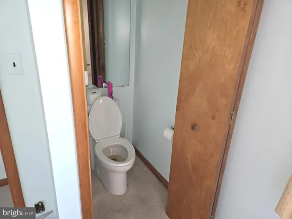 a bathroom with a toilet and a sink