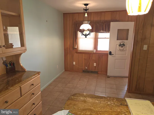 a view of kitchen with livingroom and window