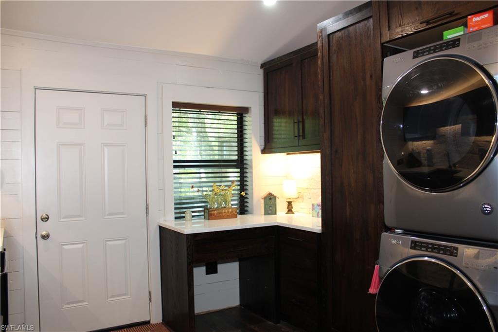 6285 Parkers Hammock Road, Unit B Naples, FL 34112 - Photo 12 of 33 a view of washer and dryer in a utility room