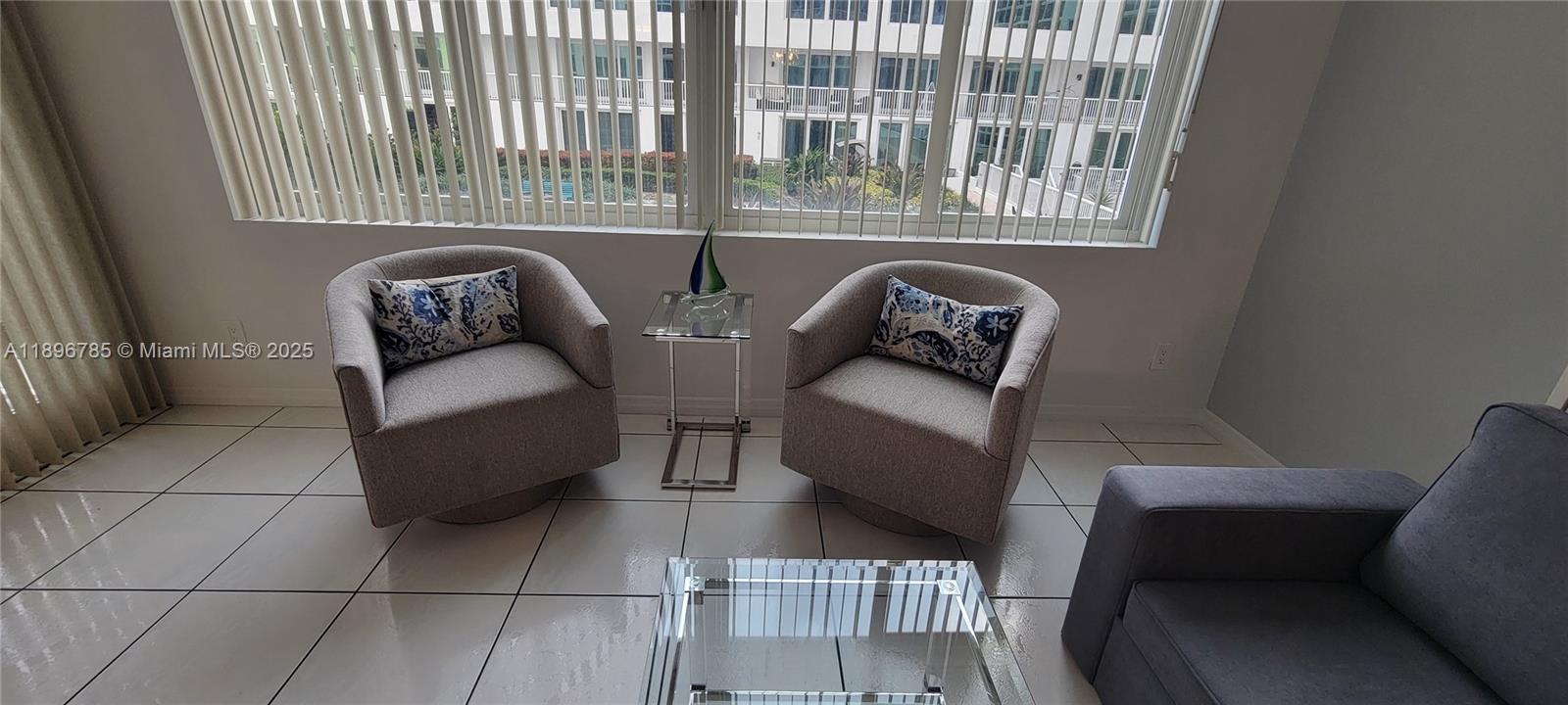 5401 Collins Avenue, Unit 214 Miami Beach, FL 33140 - Photo 18 of 37 a view of a livingroom with couch and furniture
