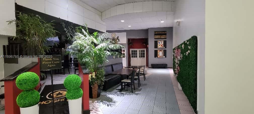 5401 Collins Avenue, Unit 214 Miami Beach, FL 33140 - Photo 25 of 37 a view of a porch with chairs and potted plants