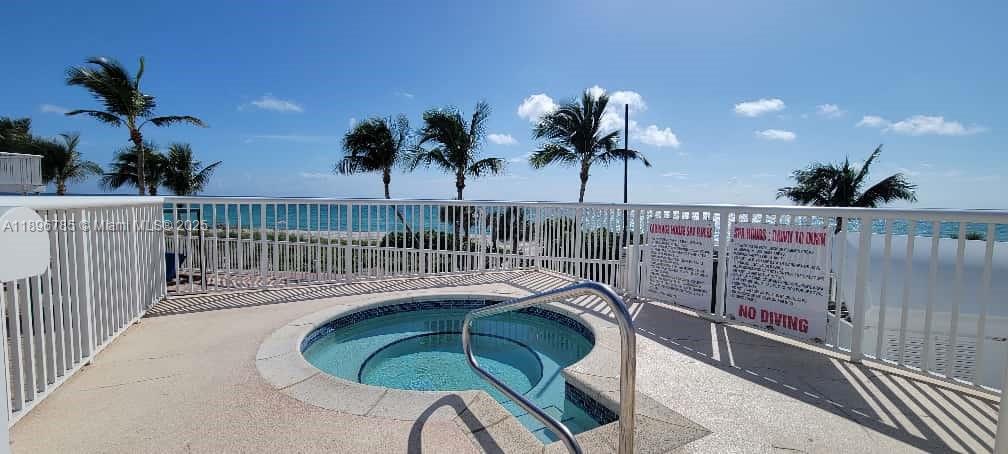 5401 Collins Avenue, Unit 214 Miami Beach, FL 33140 - Photo 30 of 37 a balcony with view of palm trees
