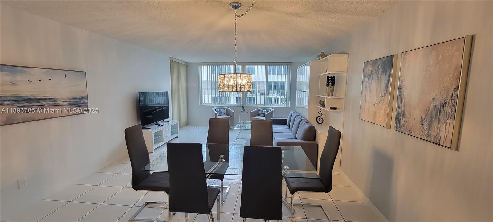 5401 Collins Avenue, Unit 214 Miami Beach, FL 33140 - Photo 8 of 37 a view of a dining room with furniture window and outside view