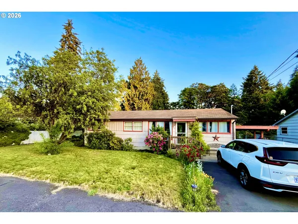 a front view of a house with garden