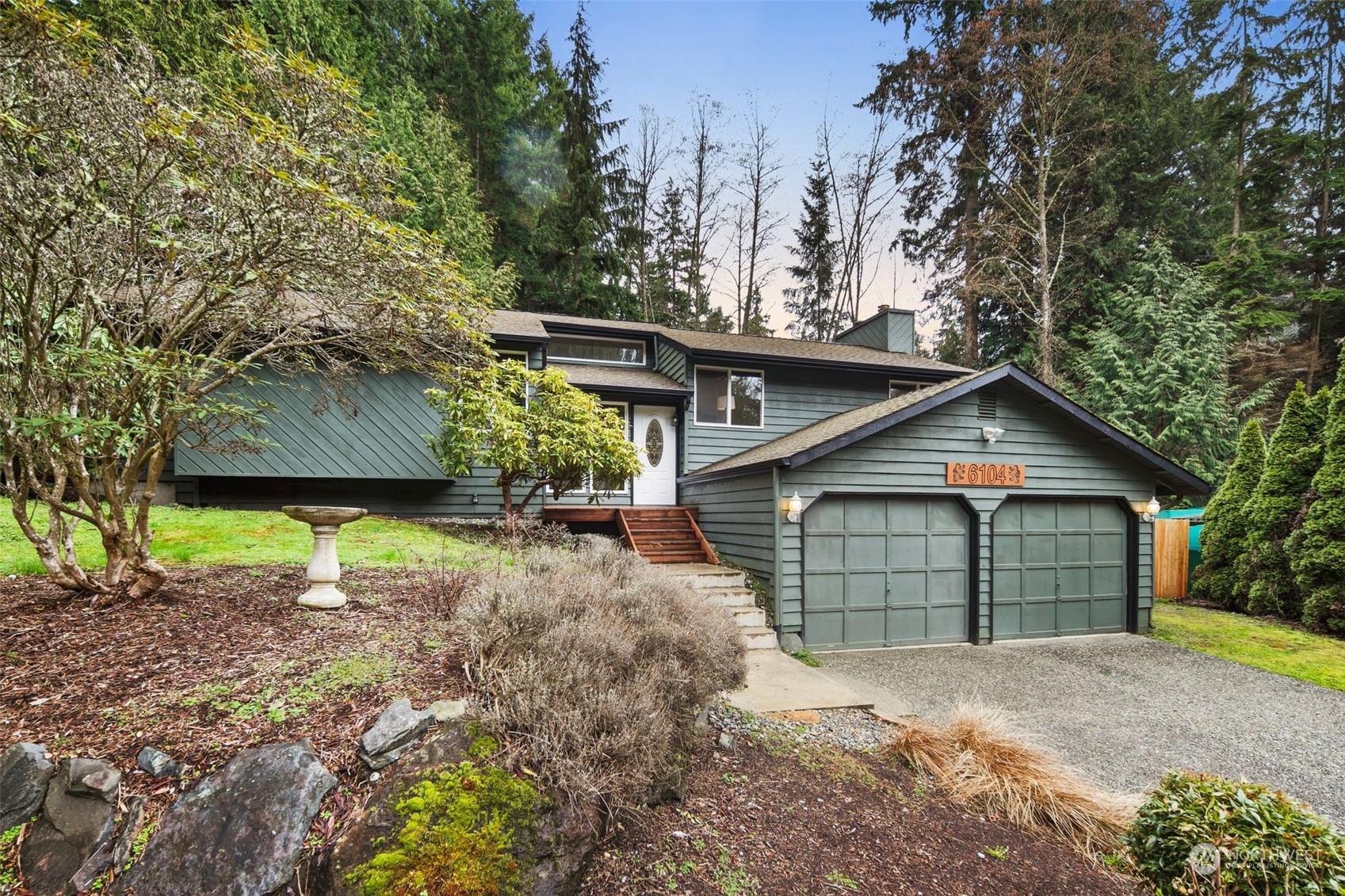 6104 145th Street Southwest Edmonds, WA 98026 - Photo 1 of 29 a front view of a house with a yard and garage