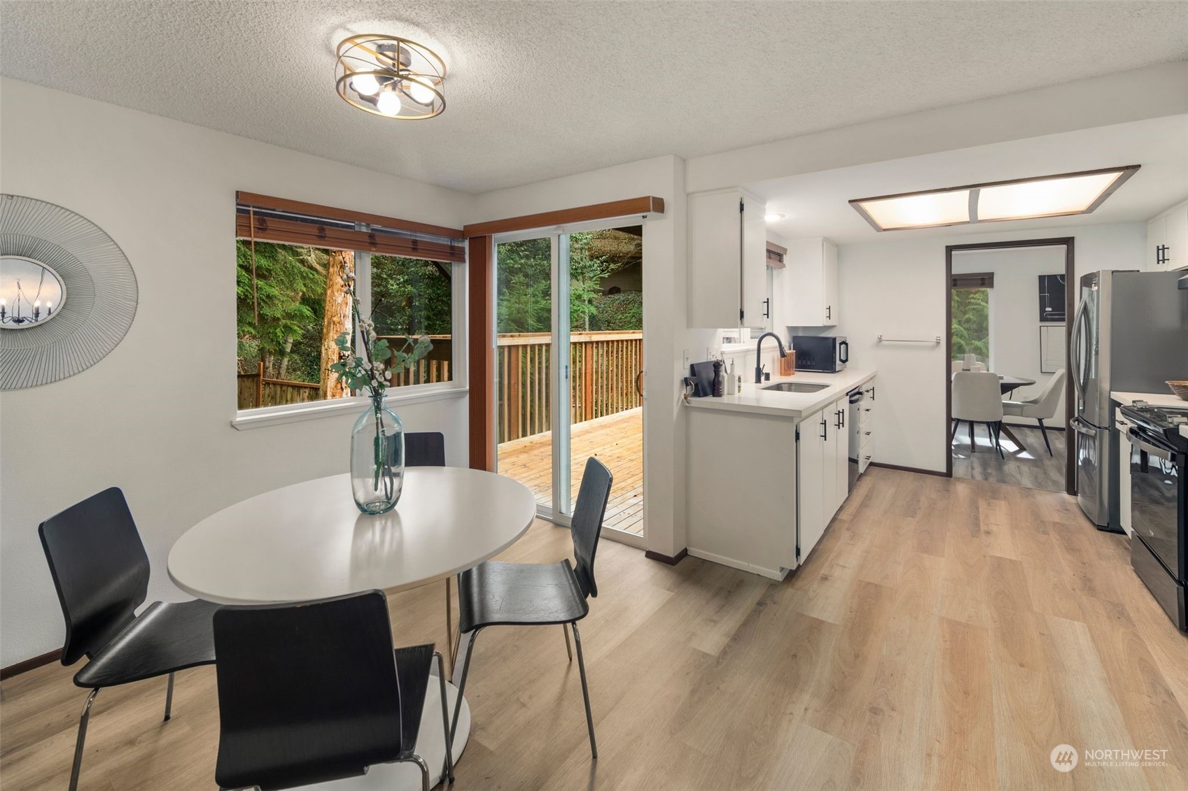 6104 145th Street Southwest Edmonds, WA 98026 - Photo 12 of 29 a view of a dining room with furniture window and outside view