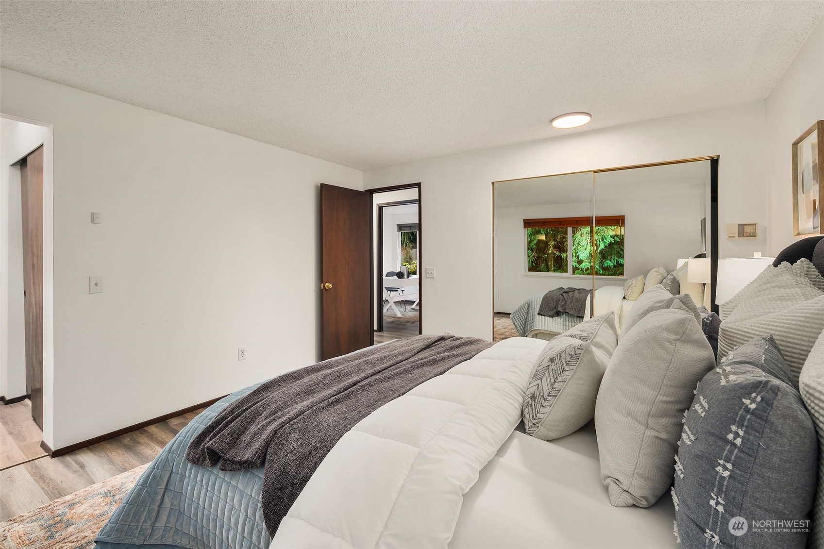 6104 145th Street Southwest Edmonds, WA 98026 - Photo 15 of 29 a bedroom with a large bed and a window