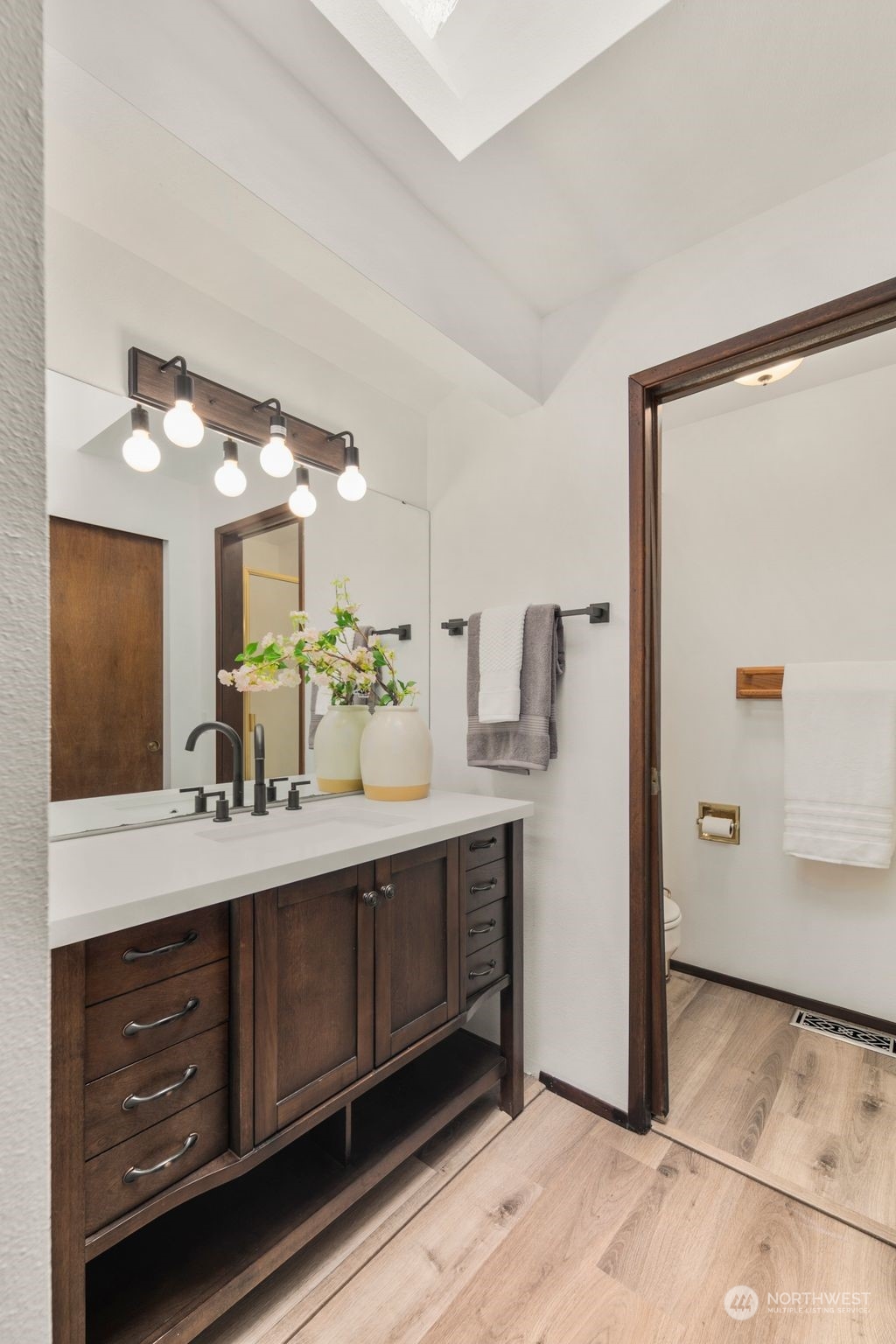 6104 145th Street Southwest Edmonds, WA 98026 - Photo 16 of 29 a bathroom with a double vanity sink and mirror