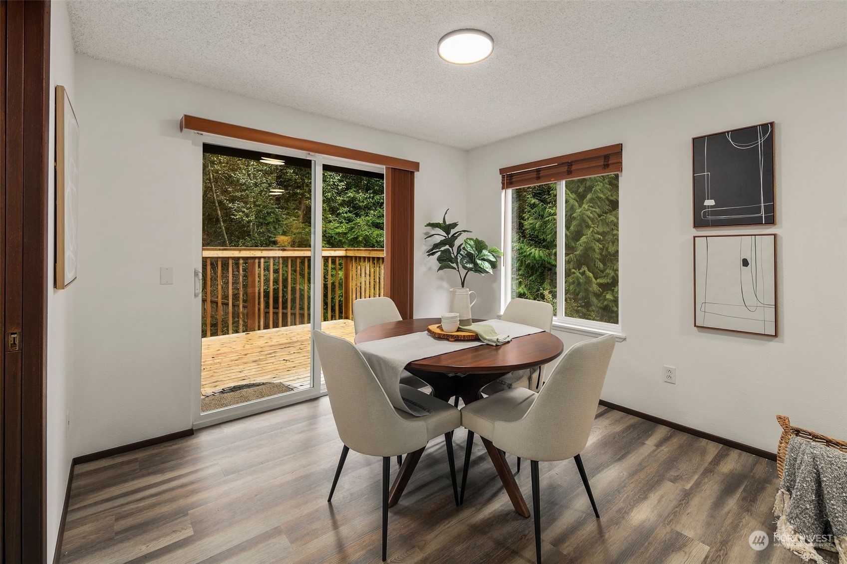 6104 145th Street Southwest Edmonds, WA 98026 - Photo 20 of 29 a view of a dining room with furniture and wooden floor