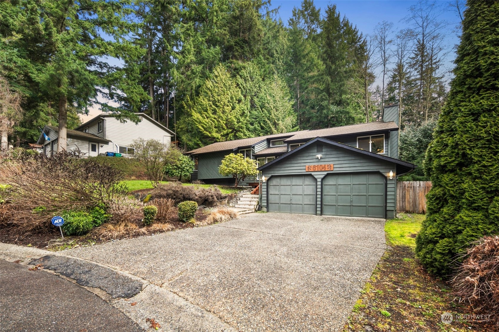 6104 145th Street Southwest Edmonds, WA 98026 - Photo 2 of 29 a front view of a house with a yard and garage