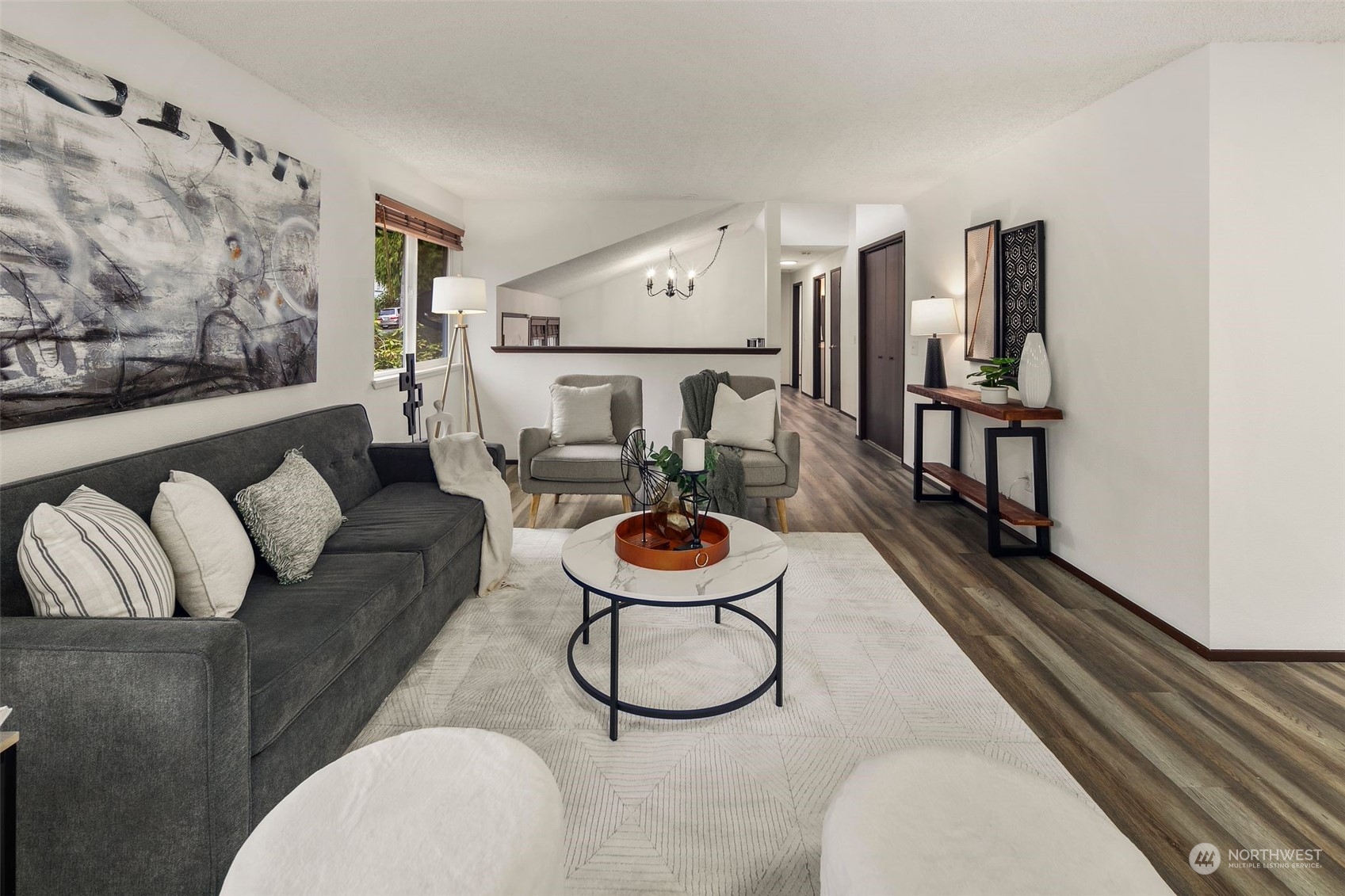 6104 145th Street Southwest Edmonds, WA 98026 - Photo 5 of 29 a living room with furniture a rug and a wall painting
