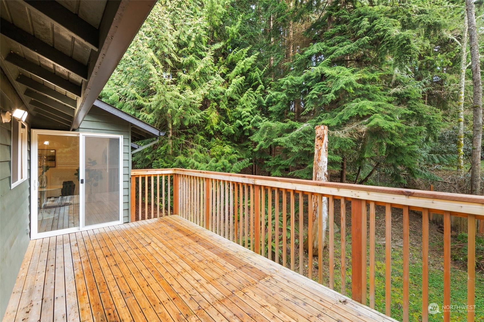 6104 145th Street Southwest Edmonds, WA 98026 - Photo 9 of 29 a balcony with wooden floor and fence
