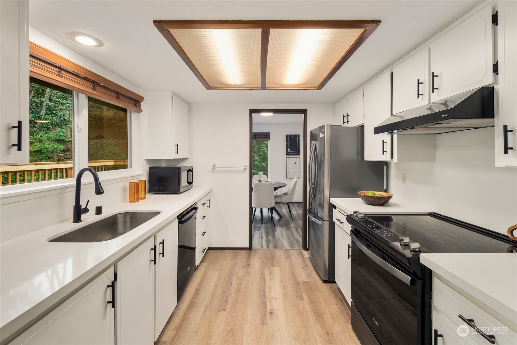 6104 145th Street Southwest Edmonds, WA 98026 - Photo 10 of 29 a kitchen with stainless steel appliances granite countertop a sink stove and refrigerator