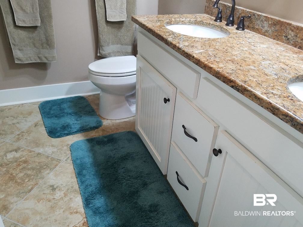 25773 Canal Road, Unit 41 Orange Beach, AL 36561 - Photo 10 of 34 Beautiful Bath/Double Vanities natural stone floor