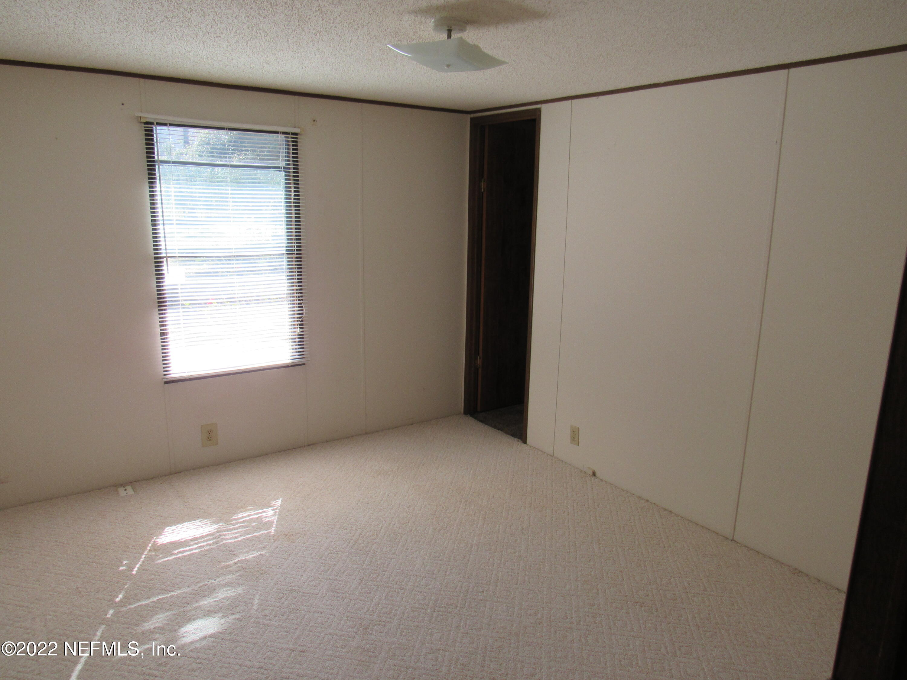 2284 Marlee Road South Jacksonville, FL 32259 - Photo 15 of 19 a view of an empty room with a window