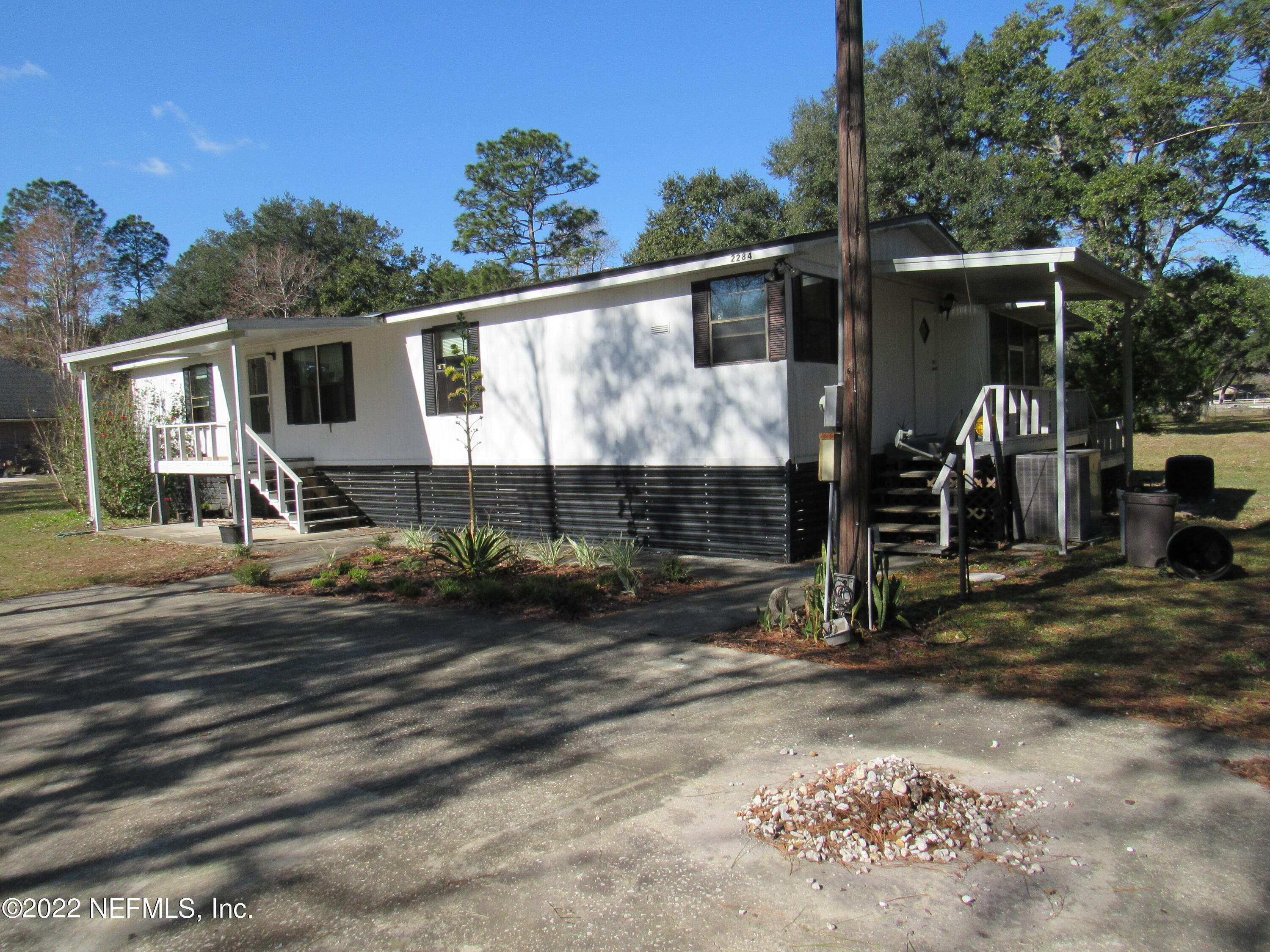 2284 Marlee Road South Jacksonville, FL 32259 - Photo 2 of 19 a view of a barn house next to a yard