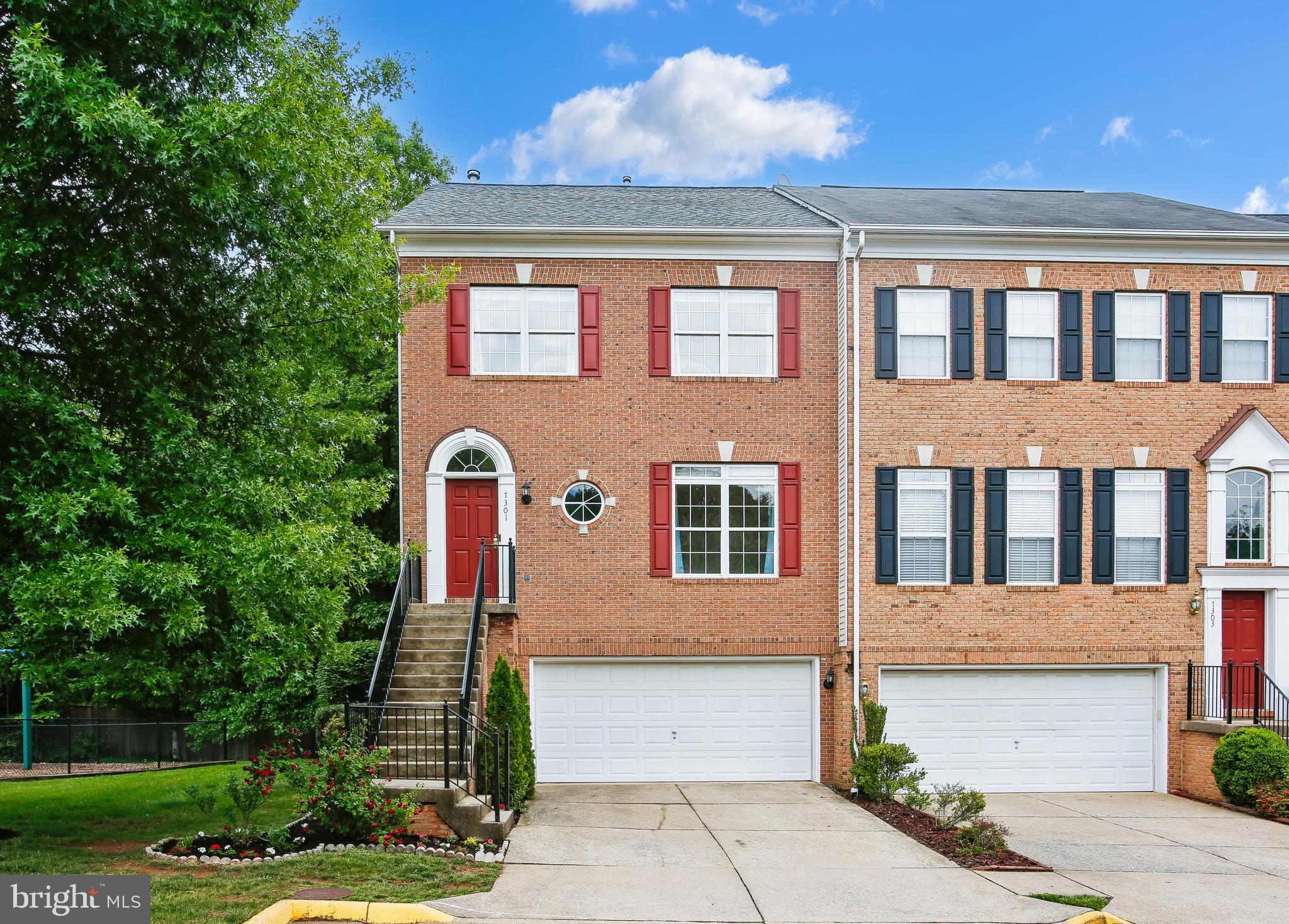 7301 Oldham Leeds Way Springfield, VA 22150 - Photo 1 of 34 a front view of a house with a yard