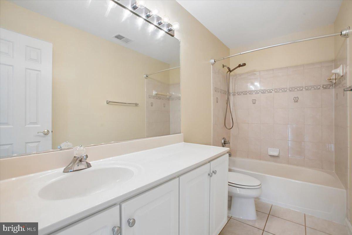 7301 Oldham Leeds Way Springfield, VA 22150 - Photo 21 of 34 a bathroom with a sink a toilet and shower