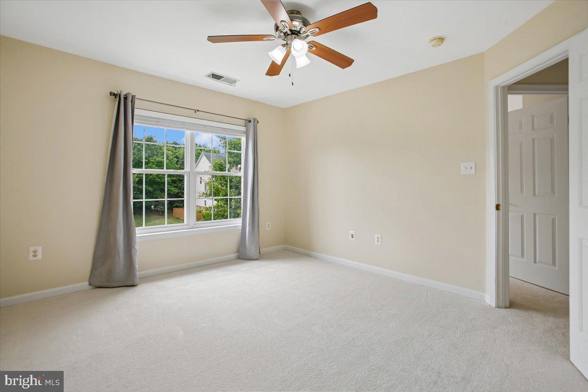 7301 Oldham Leeds Way Springfield, VA 22150 - Photo 23 of 34 a view of an empty room with a window