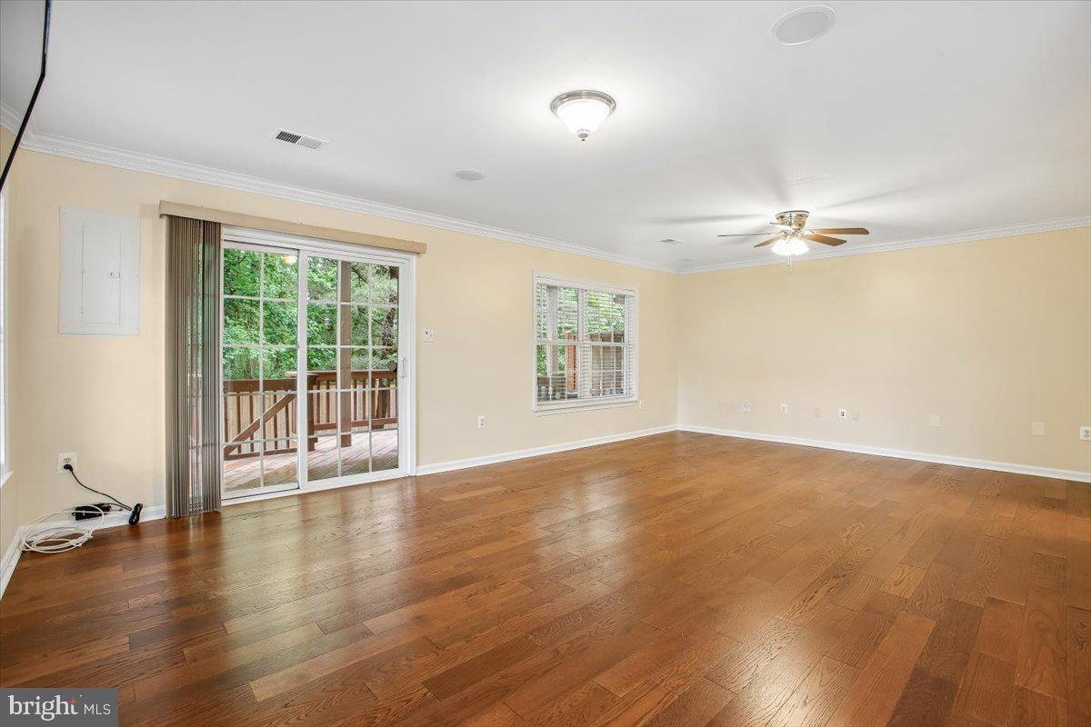 7301 Oldham Leeds Way Springfield, VA 22150 - Photo 24 of 34 wooden floor in an empty room with a window