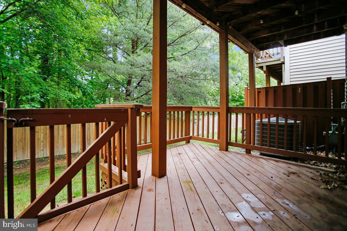 7301 Oldham Leeds Way Springfield, VA 22150 - Photo 28 of 34 a view of balcony with wooden floor