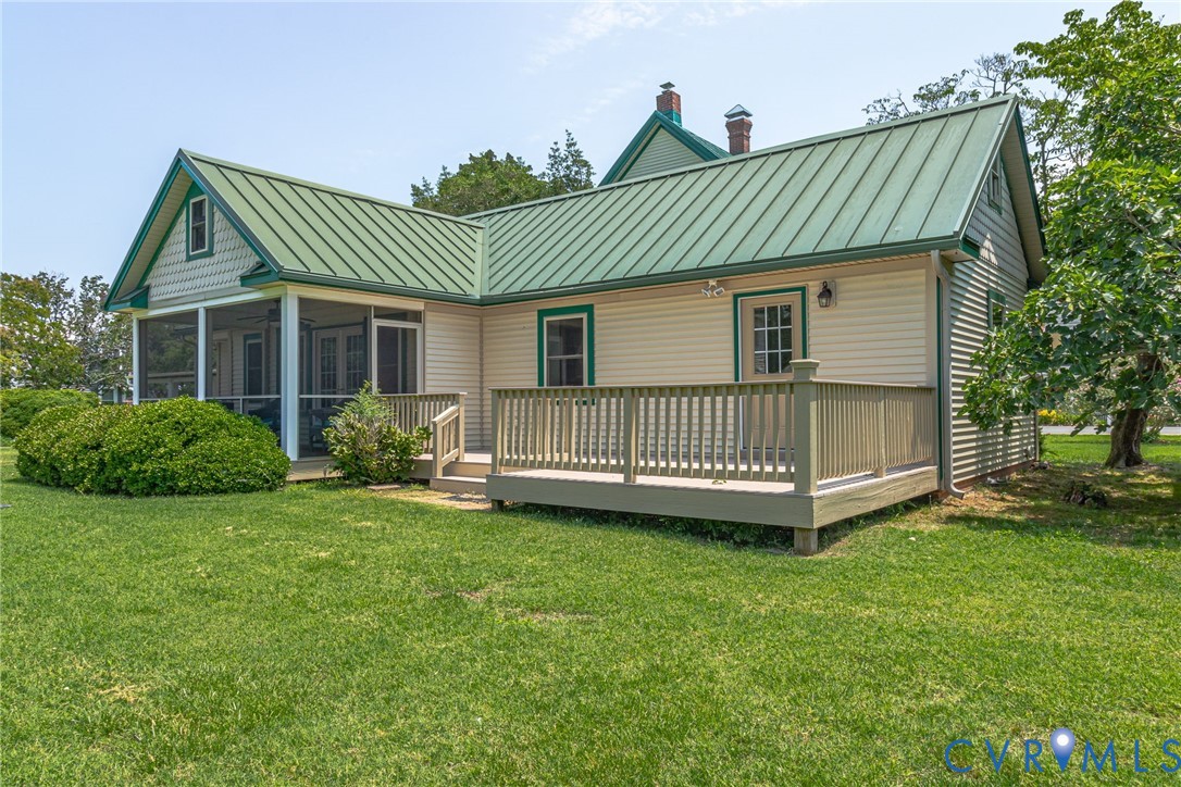 618 Main Street Reedville, VA 22539 - Photo 38 of 54 Exterior featuring a green metal roof, siding, and