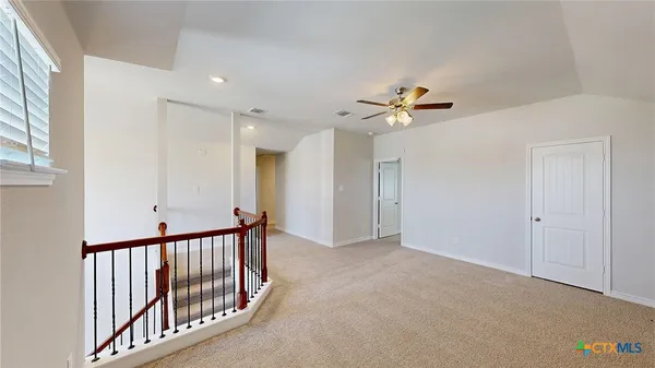 a view of a hallway with a white walls