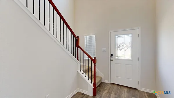 a kitchen with stainless steel appliances granite countertop a sink stove and microwave