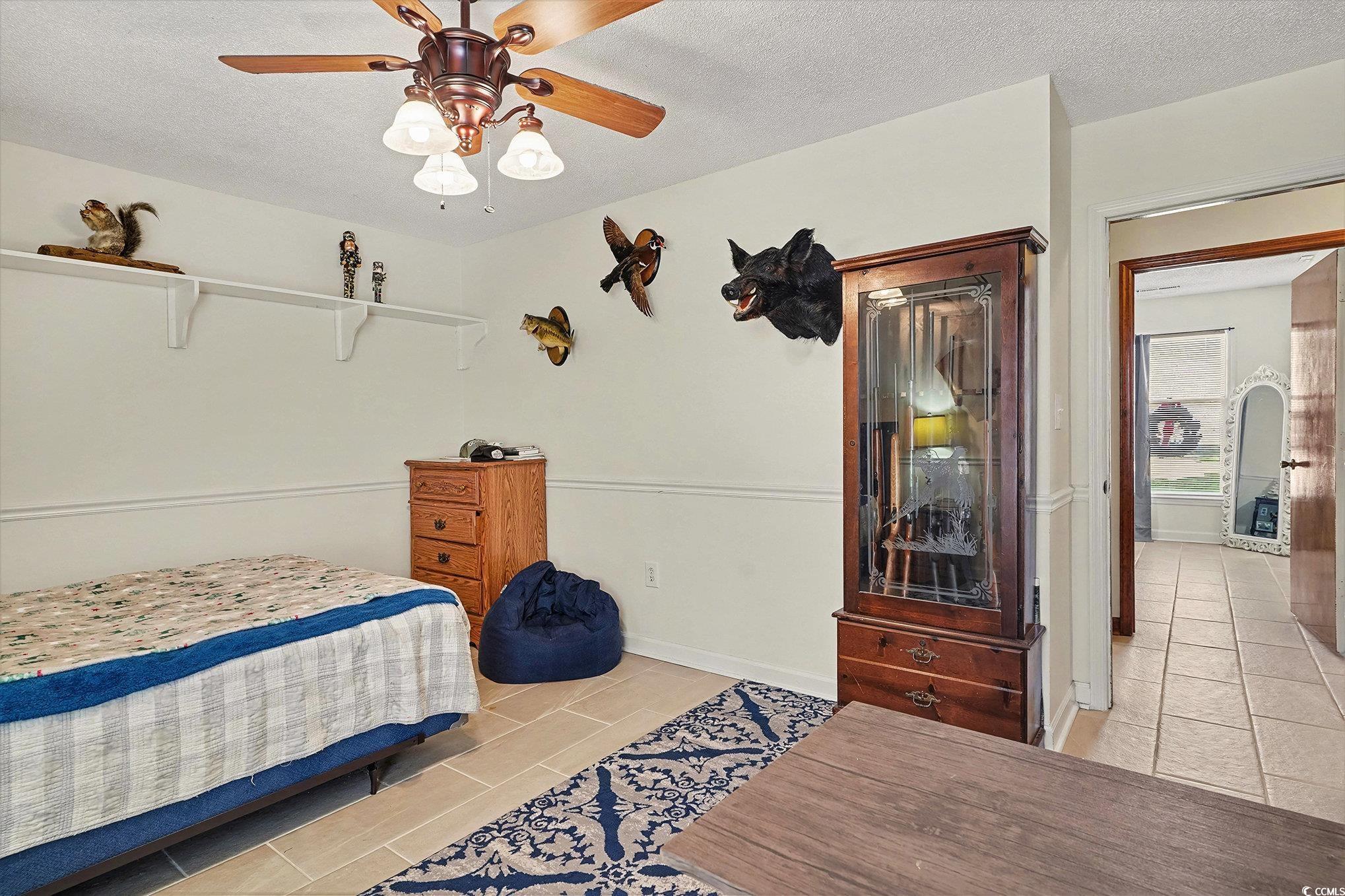 5175 Bottle Branch Road Conway, SC 29527 - Photo 15 of 28 Bedroom featuring a textured ceiling, ceiling fan, and an office area