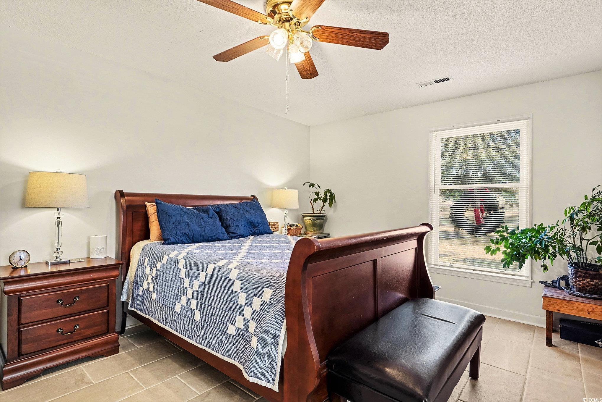 5175 Bottle Branch Road Conway, SC 29527 - Photo 19 of 28 Bathroom with vanity, a stall shower, healthy amount of natural light, and light tile patterned flooring