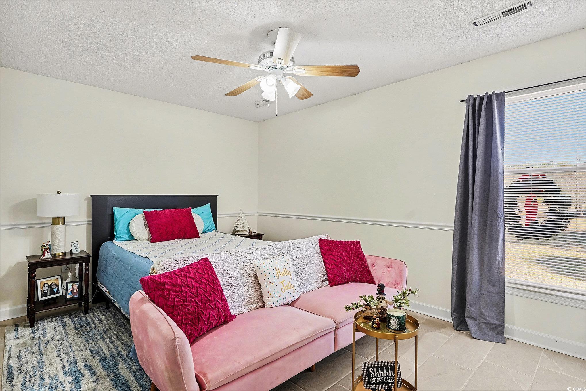 5175 Bottle Branch Road Conway, SC 29527 - Photo 21 of 28 Bedroom with a textured ceiling, a ceiling fan, and light tile patterned floors