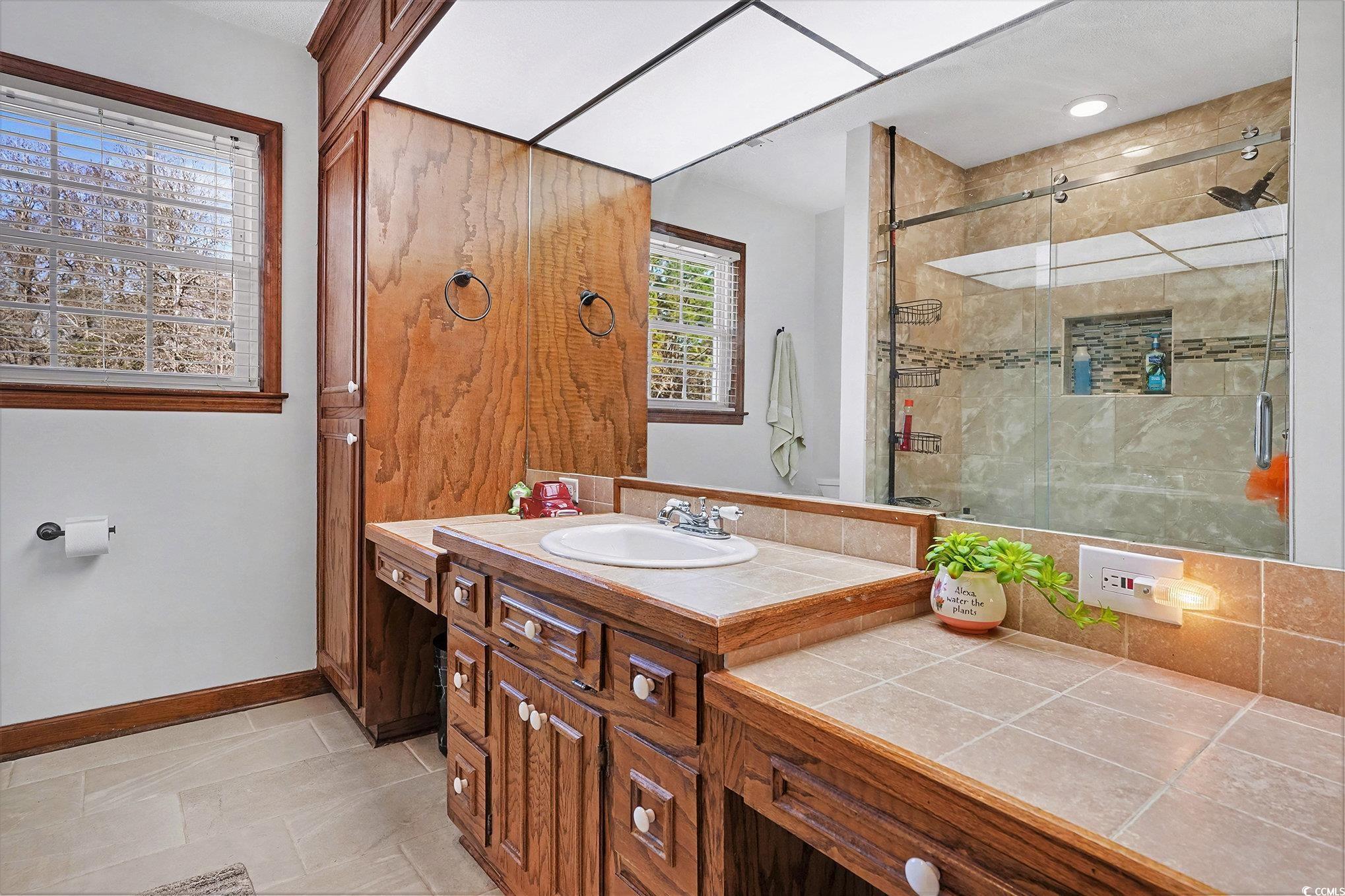 5175 Bottle Branch Road Conway, SC 29527 - Photo 23 of 28 Bedroom with ceiling fan, a textured ceiling, and multiple windows