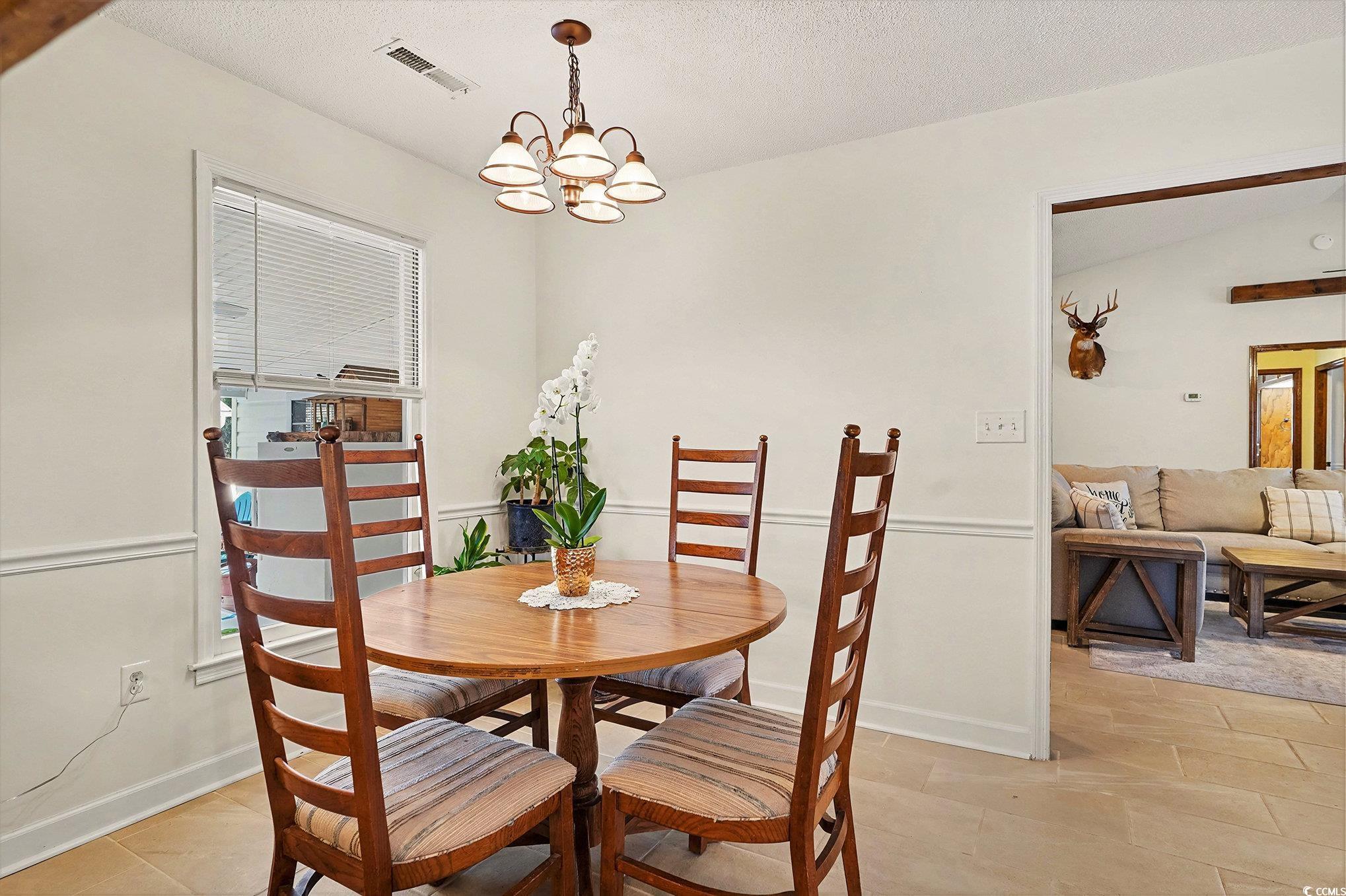 5175 Bottle Branch Road Conway, SC 29527 - Photo 8 of 28 Living area featuring lofted ceiling, a lit fireplace, ceiling fan, and wood finished floors