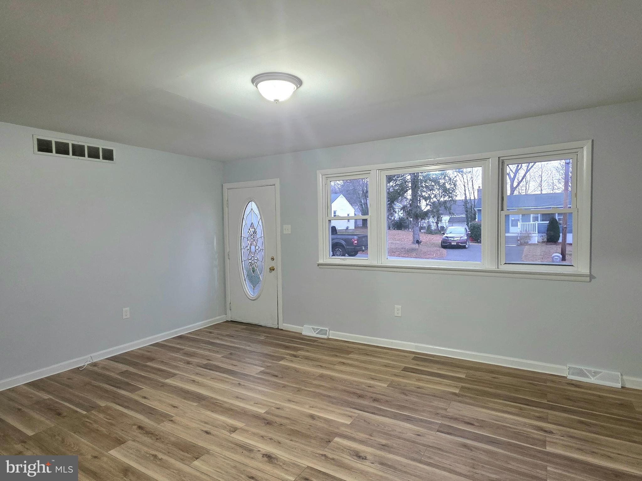 11 Fairview Avenue Bridgeton, NJ 08302 - Photo 15 of 33 a view of wooden floor and windows in a room