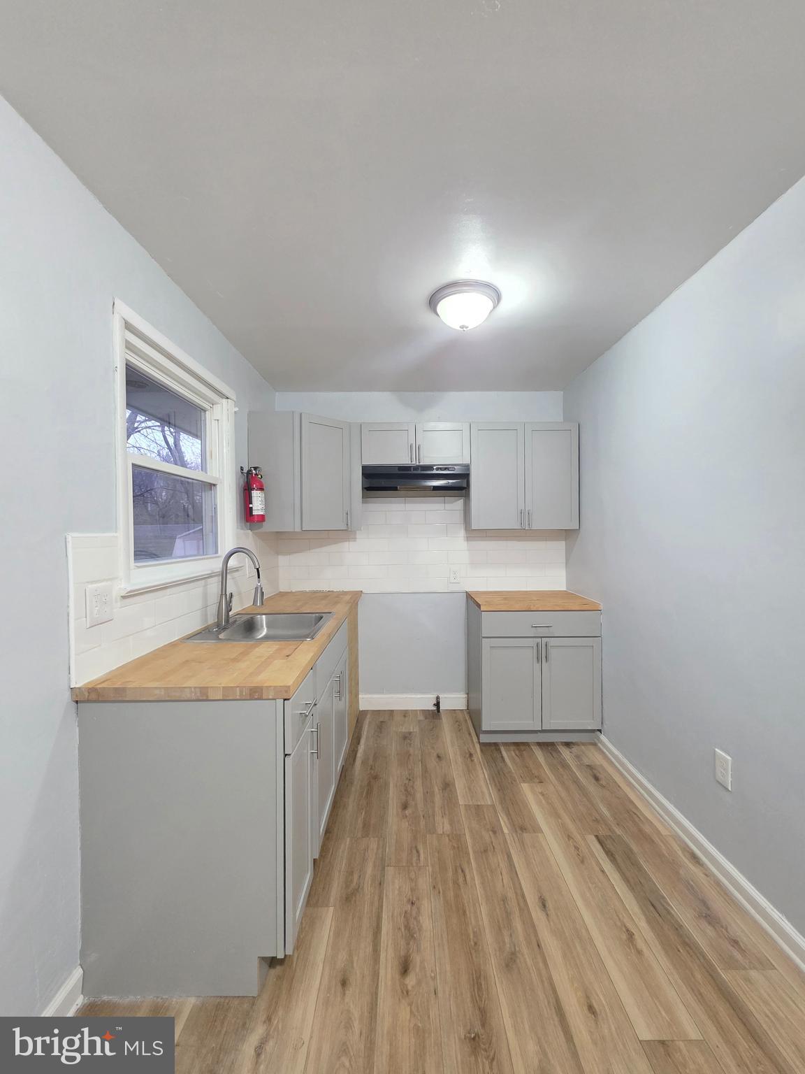 11 Fairview Avenue Bridgeton, NJ 08302 - Photo 19 of 33 a kitchen with a sink stove and cabinets