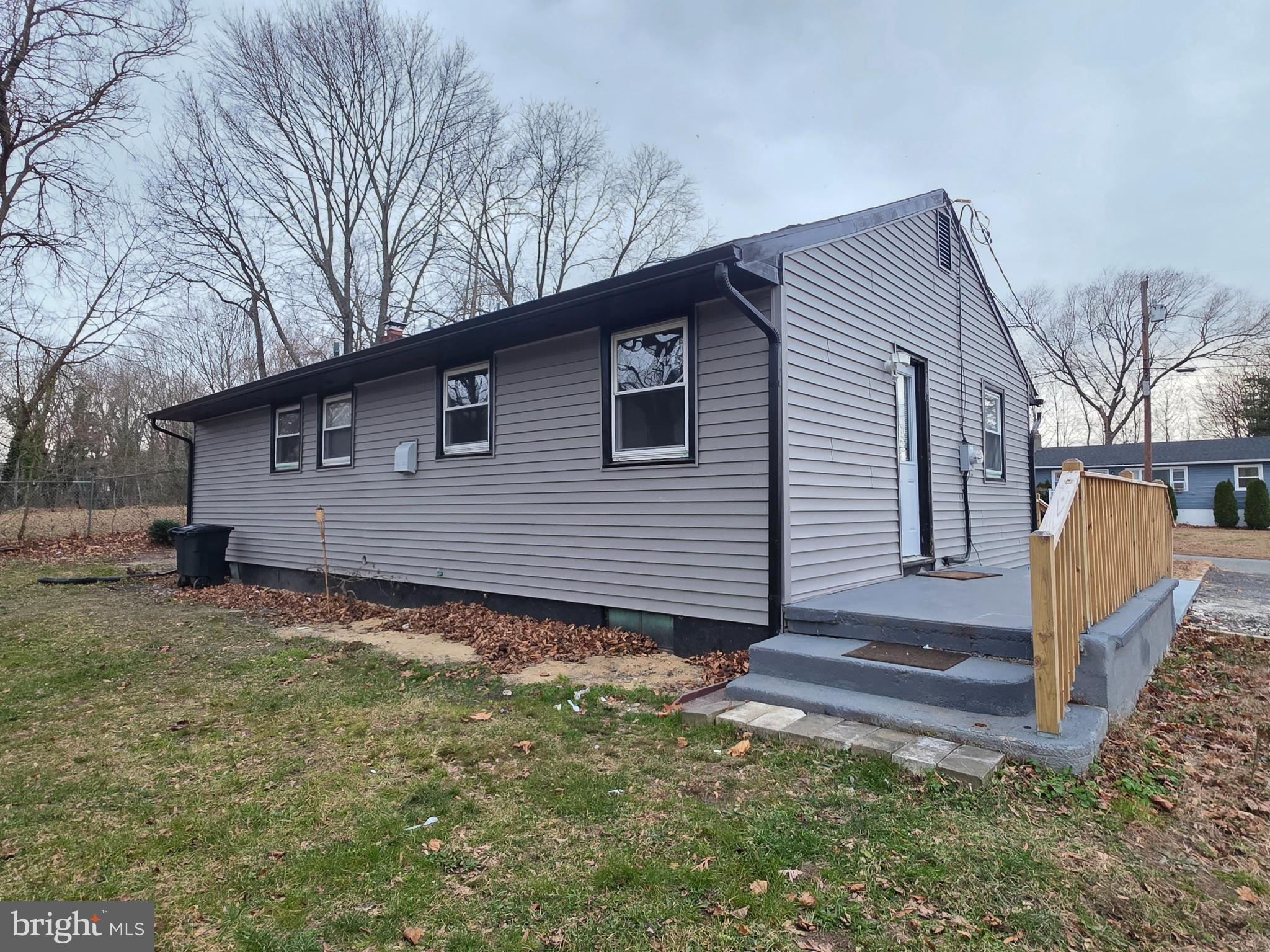 11 Fairview Avenue Bridgeton, NJ 08302 - Photo 8 of 33 a backyard of a house with large trees and wooden fence